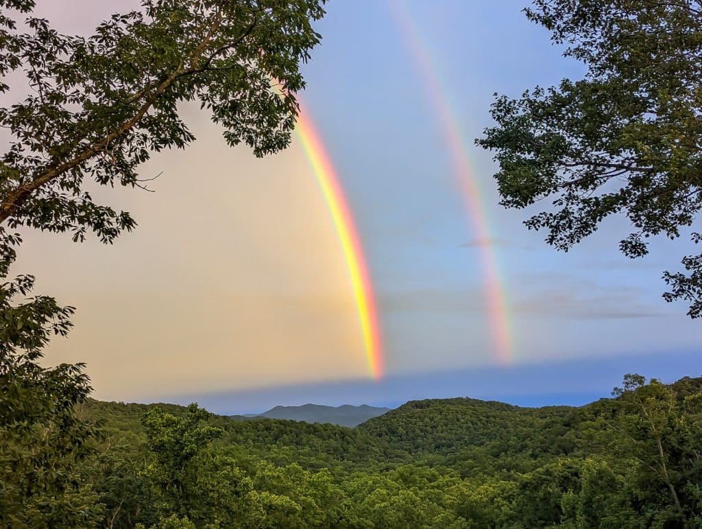 A rainbow over blue ridge mountains