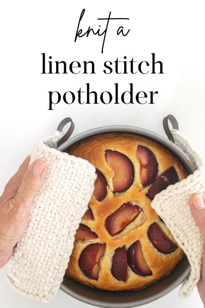 Two hands using knit potholders to hold cake.