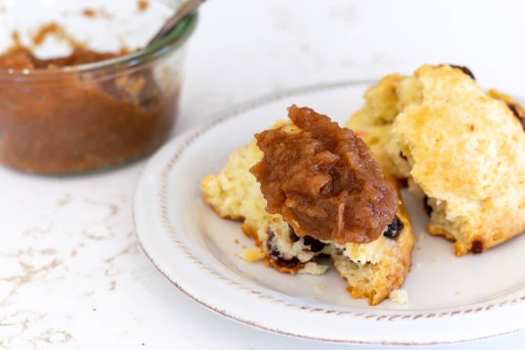 A dollop of apple butter on a scone.