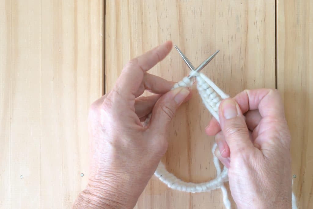 Once you attach the two ends, knitting in the round is very similar to knitting with straight needles.