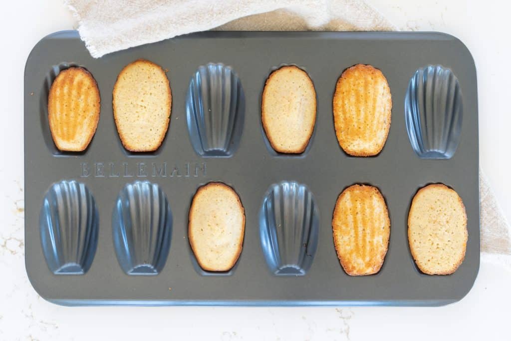 Baked Madeleines in a madeleine pan.