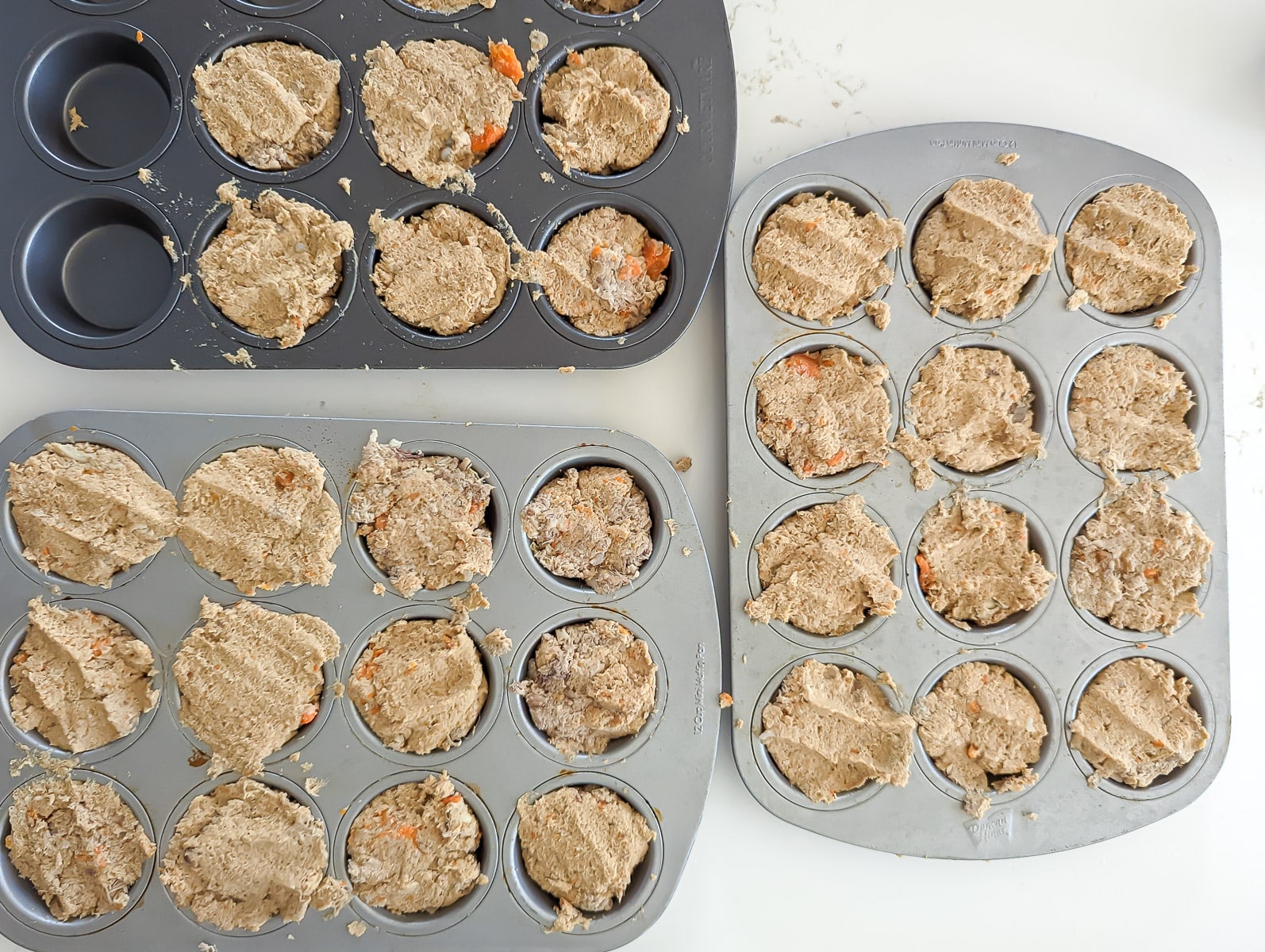 Meat in muffin tins for dogs.