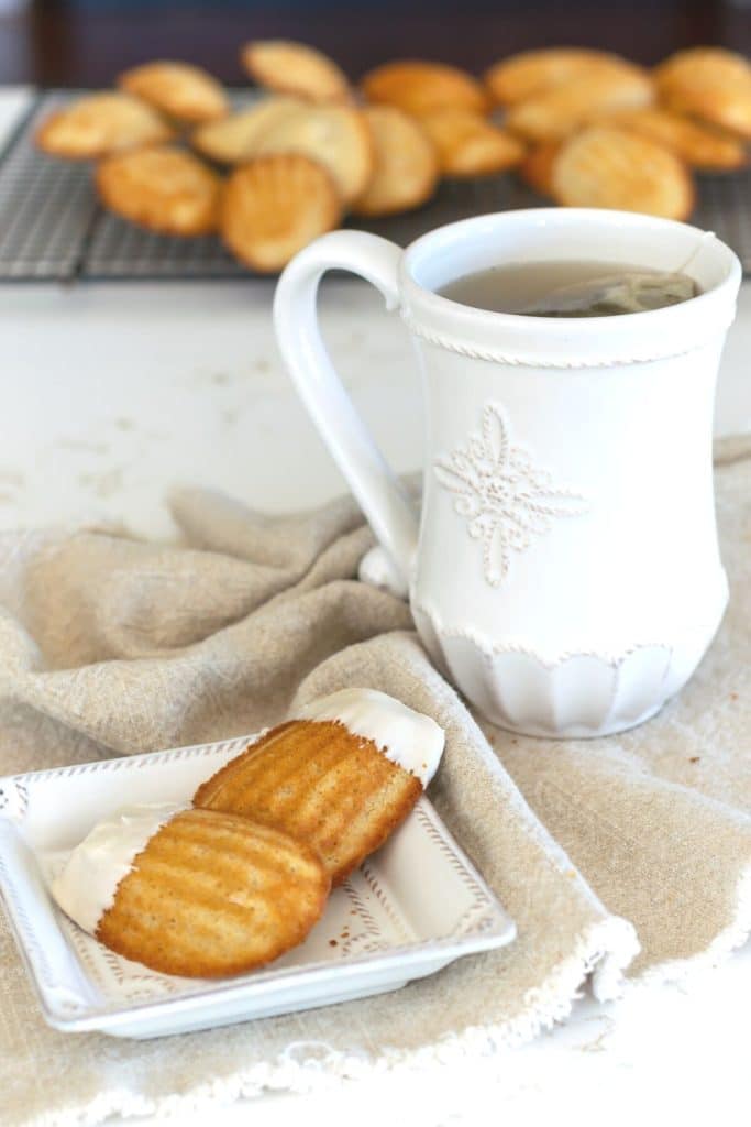 Spiced Madeleines with maple glaze with a cup of tea.