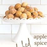 apples spice donut holes on a pedestal