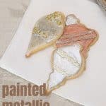Painted Metallic Sugar Cookies on a beige tablecloth