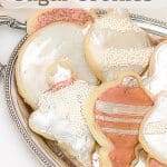 Painted Metallic Sugar Cookies on a beige tablecloth and silver tray.