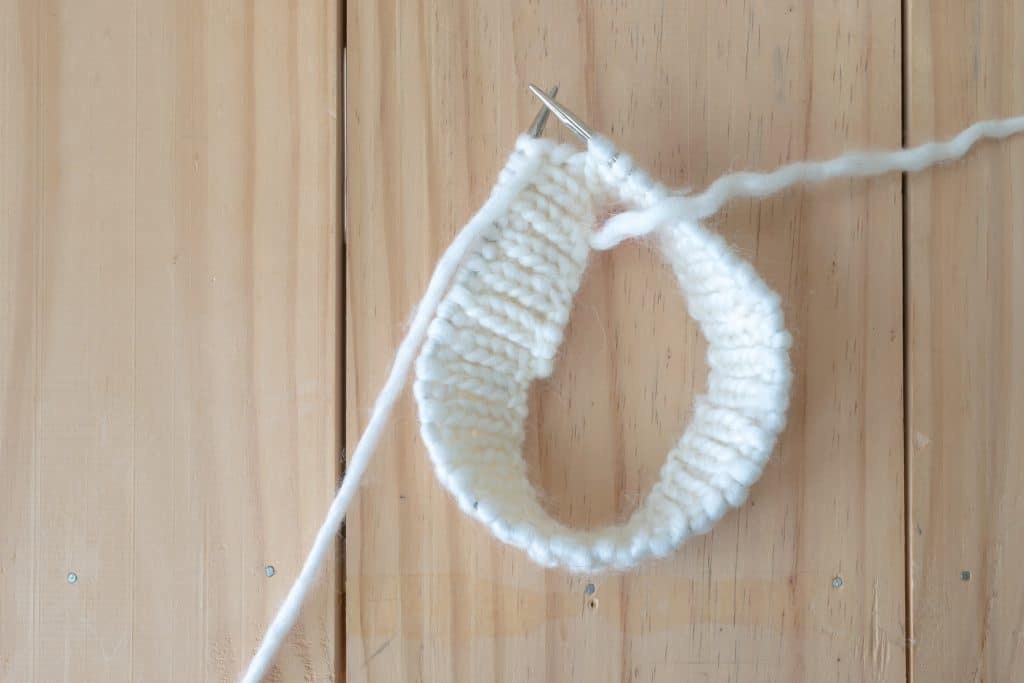 Several rounds of rib knit in the round.