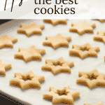 Cut out cookies on parchment paper, which is one of the baking tips included in this post.