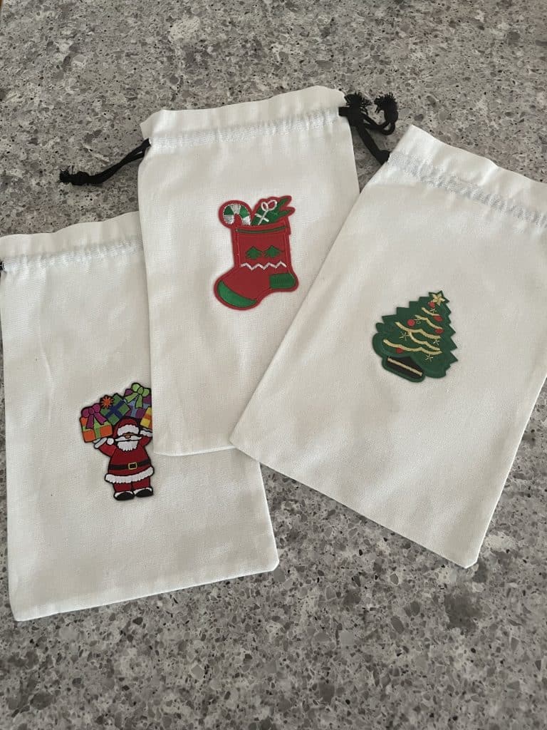 fabric bags with Christmas appliques.