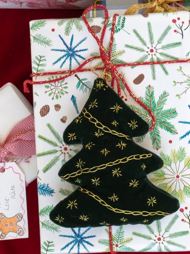 Embroidered Christmas Trees on wrapped packages.