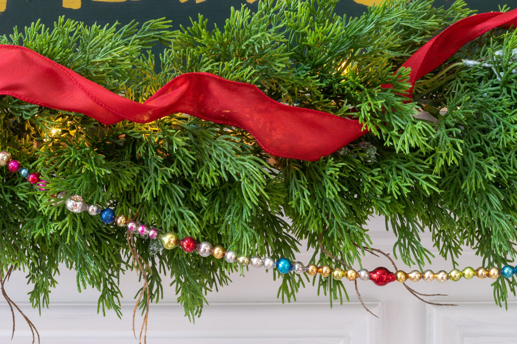 Ribbon threaded through garland.