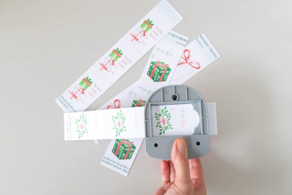 Christmas Gift Tags being punched. 