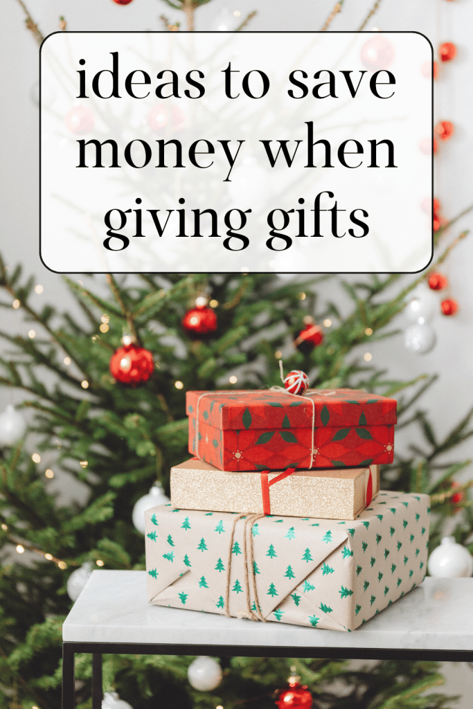 stack of gifts with Christmas tree in the background.