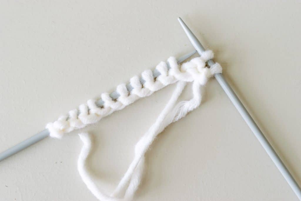 Stitches on knitting needles.