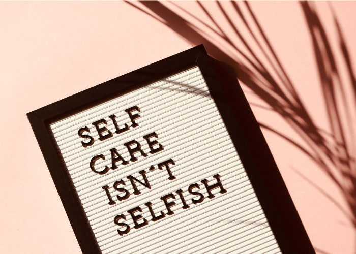 Sign that says, "Self Care Isn't Selfish' as a reminder to help prevent Mental Clutter