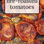 Fire Roasted tomatoes on an aluminum foil lined sheet pan.