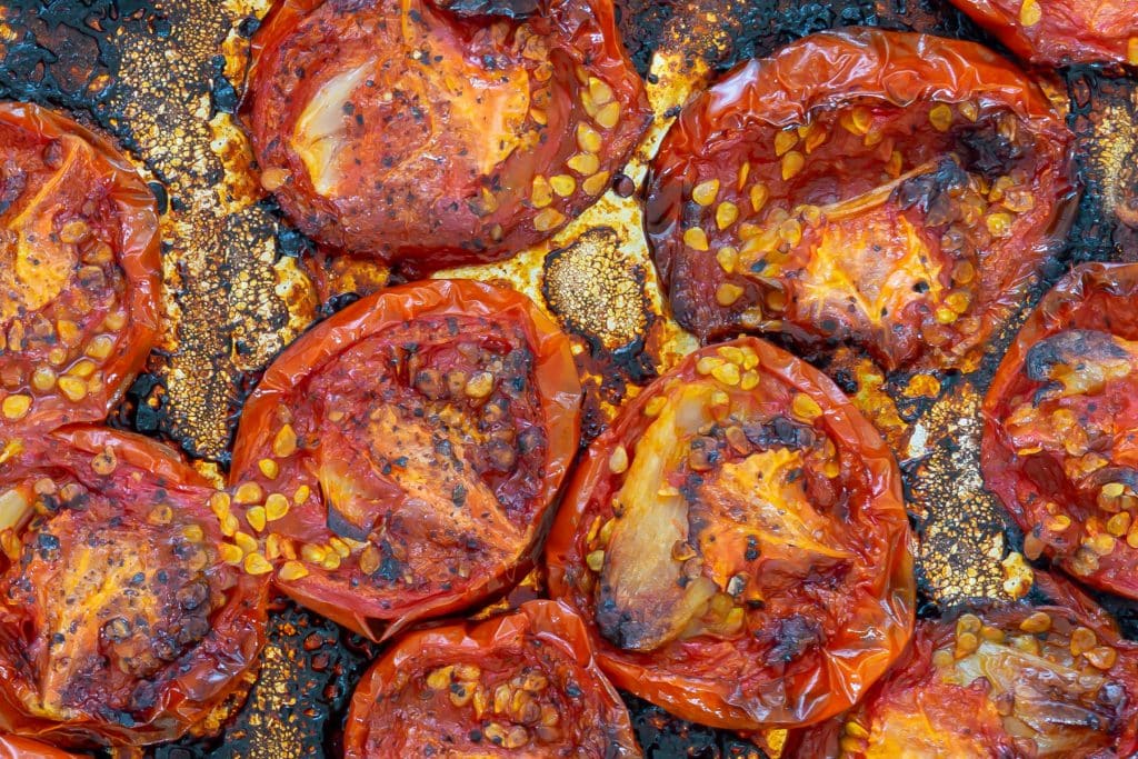 Roasted Tomatoes on a sheet of aluminum foil.