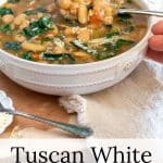 Bowl of Tuscan White Bean Soup in a white bowl .