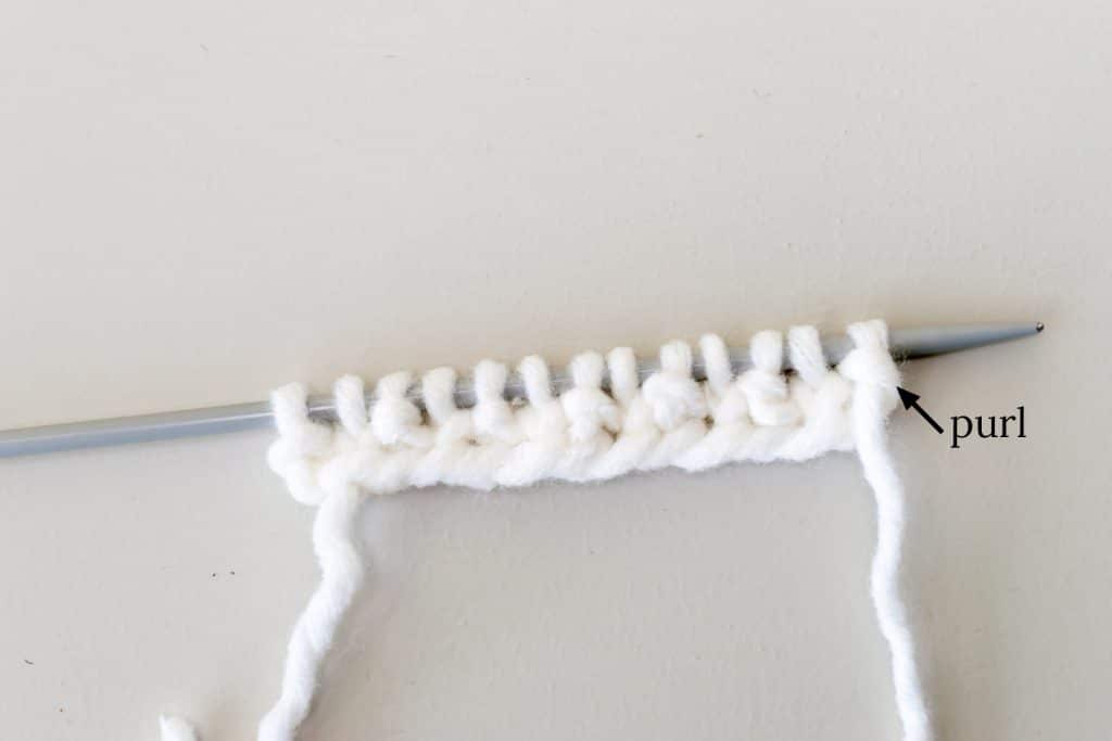 Seed stitch on knitting needles.