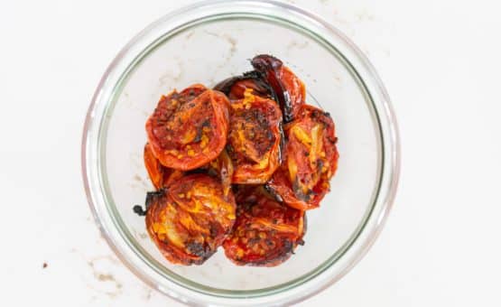 Fire Roasted Tomatoes in a clear glass jar.