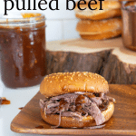 Slow cooker pulled beef on buns with barbecue sauce.