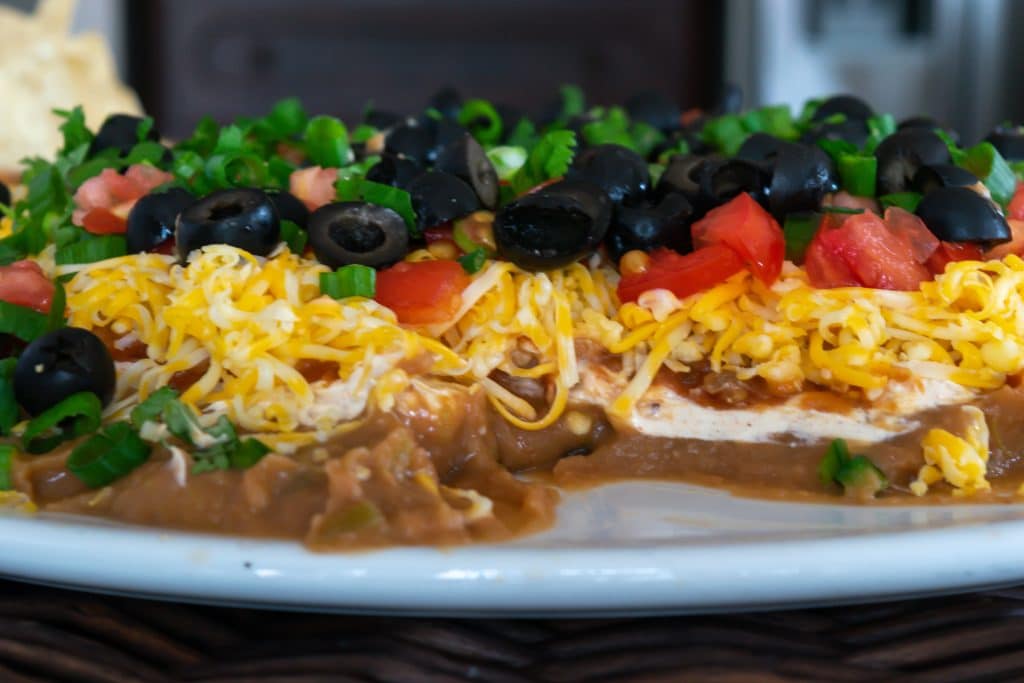 Layers of mexican layer dip.