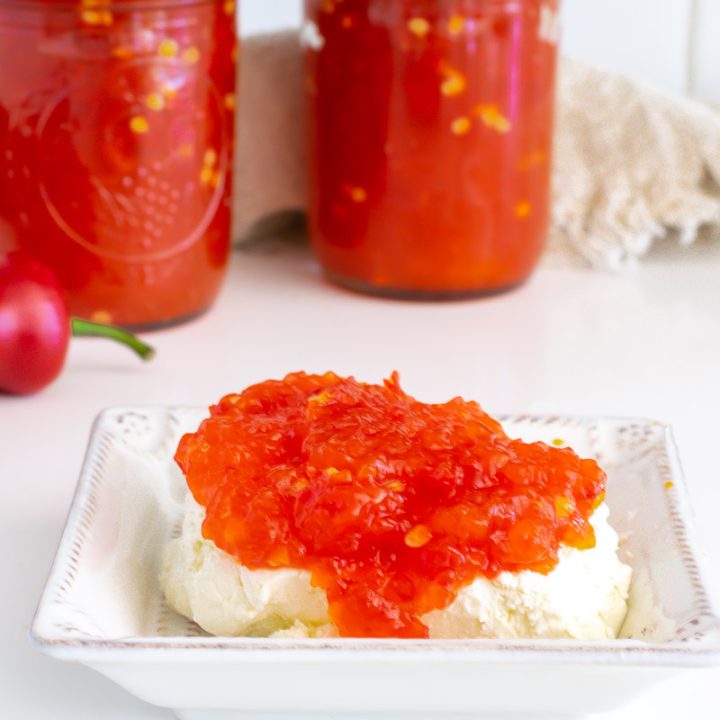 jars of red pepper jelly and red pepper jelly over cream cheese.