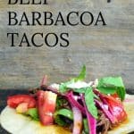 Beef Barbacoa Taco on open tortilla with onions, lettuce and tomato.