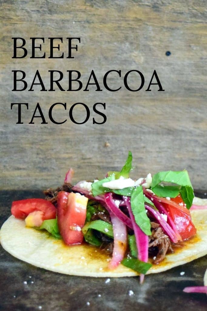 Beef Barbacoa Taco on open tortilla with onions, lettuce and tomato.