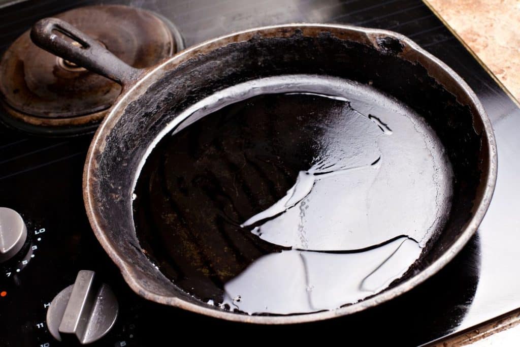 Seasoning oil in a cast iron pan.