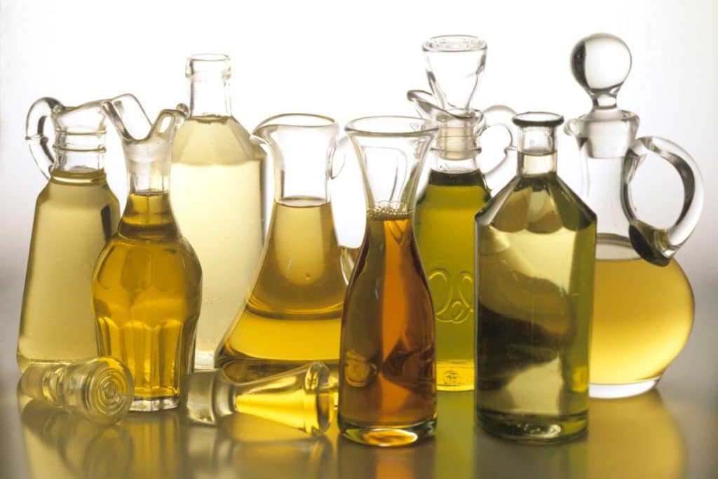 A variety of different oils in carafes.