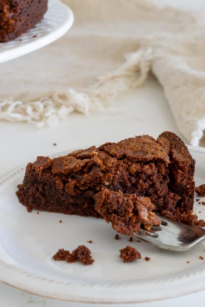 Piece of brownie cake on a plate.