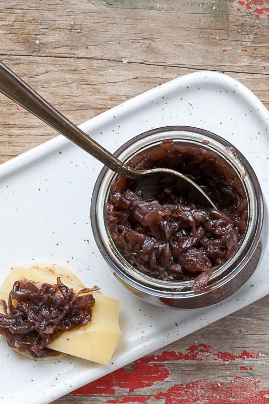 Savory onion jam on cheese.