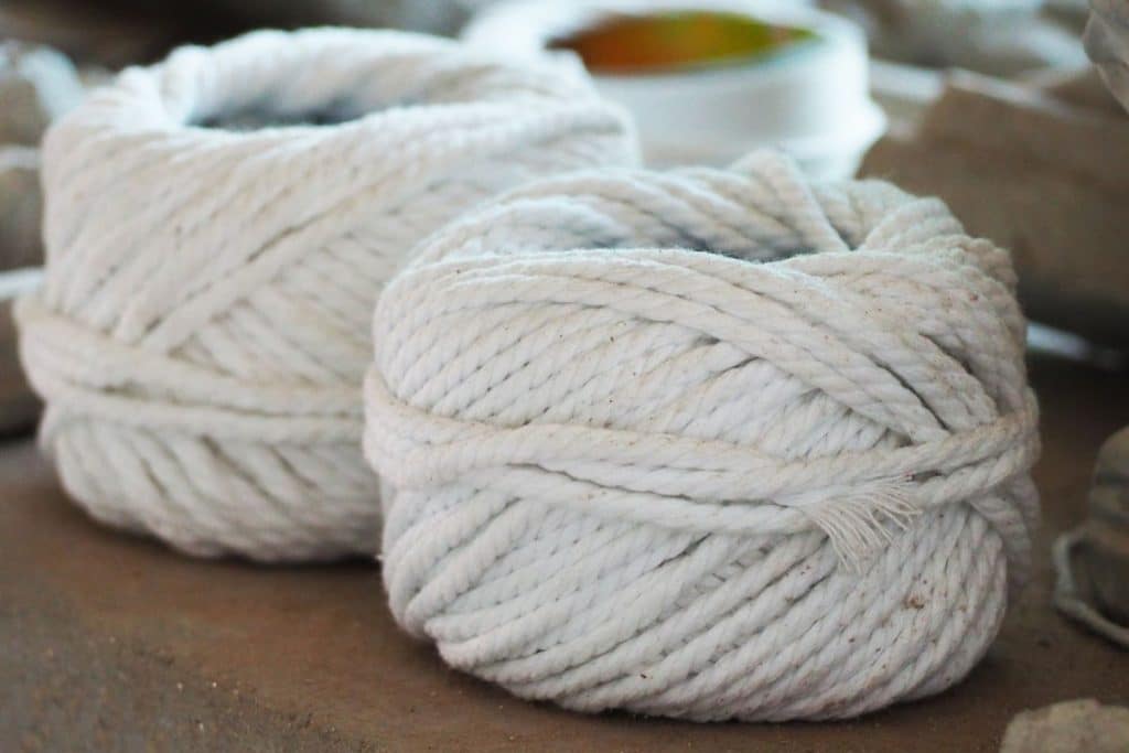 Two spools of cotton rope.