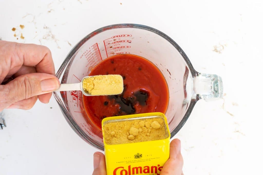 Add dry mustard to tomato sauce.