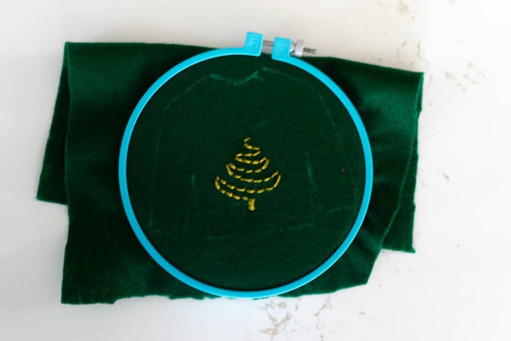 Embroidering Christmas trees.