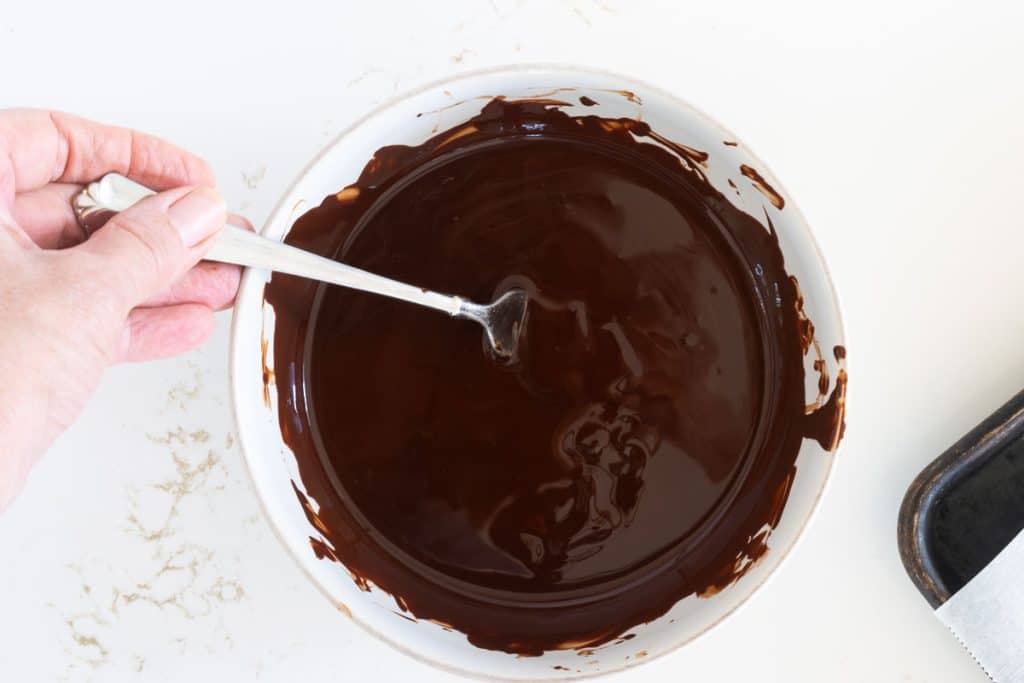 Stir melted chocolate.
