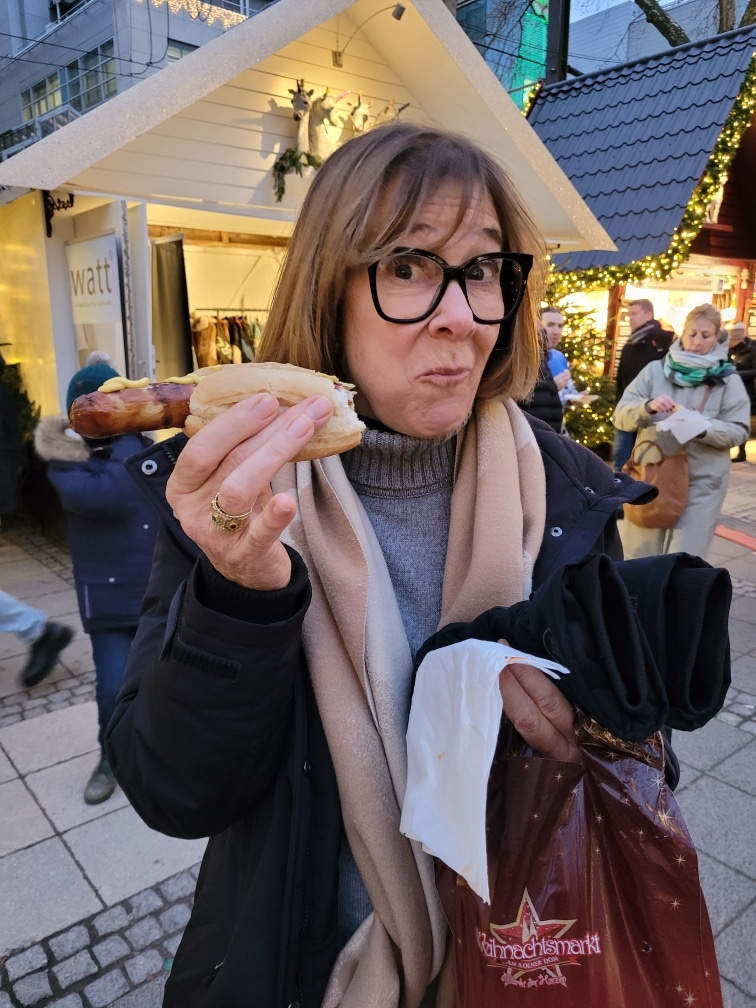 Lynn eating sausage