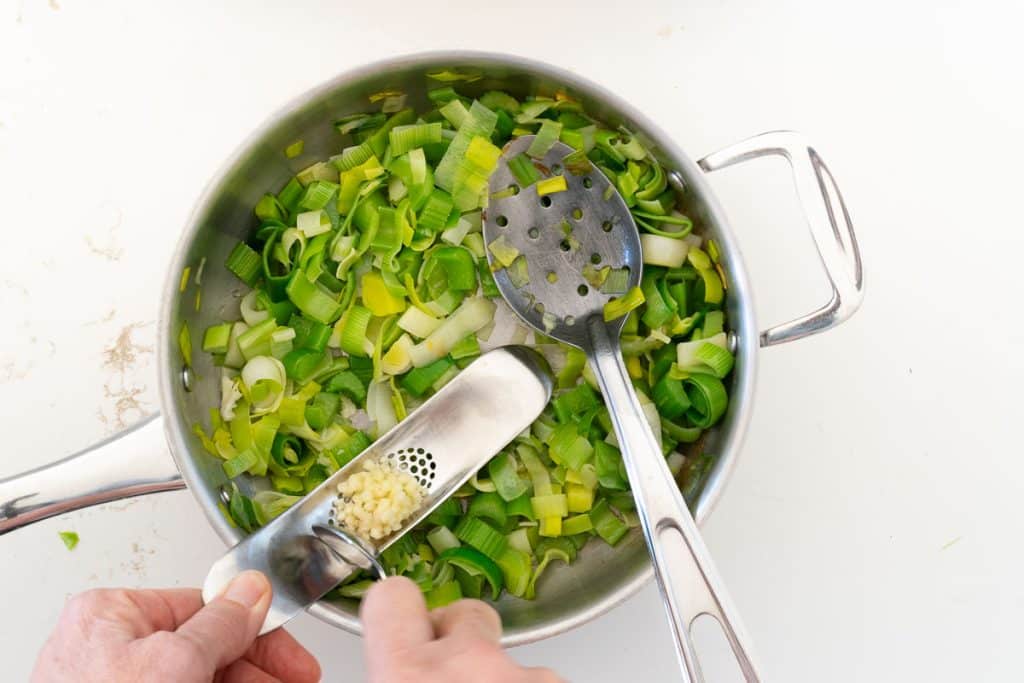 add garlic to sauteed leeks and celery.