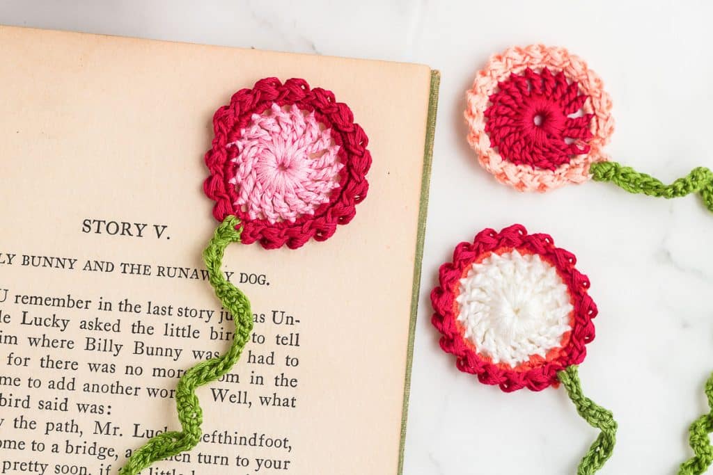 Flower Crochet Bookmarks on a book.