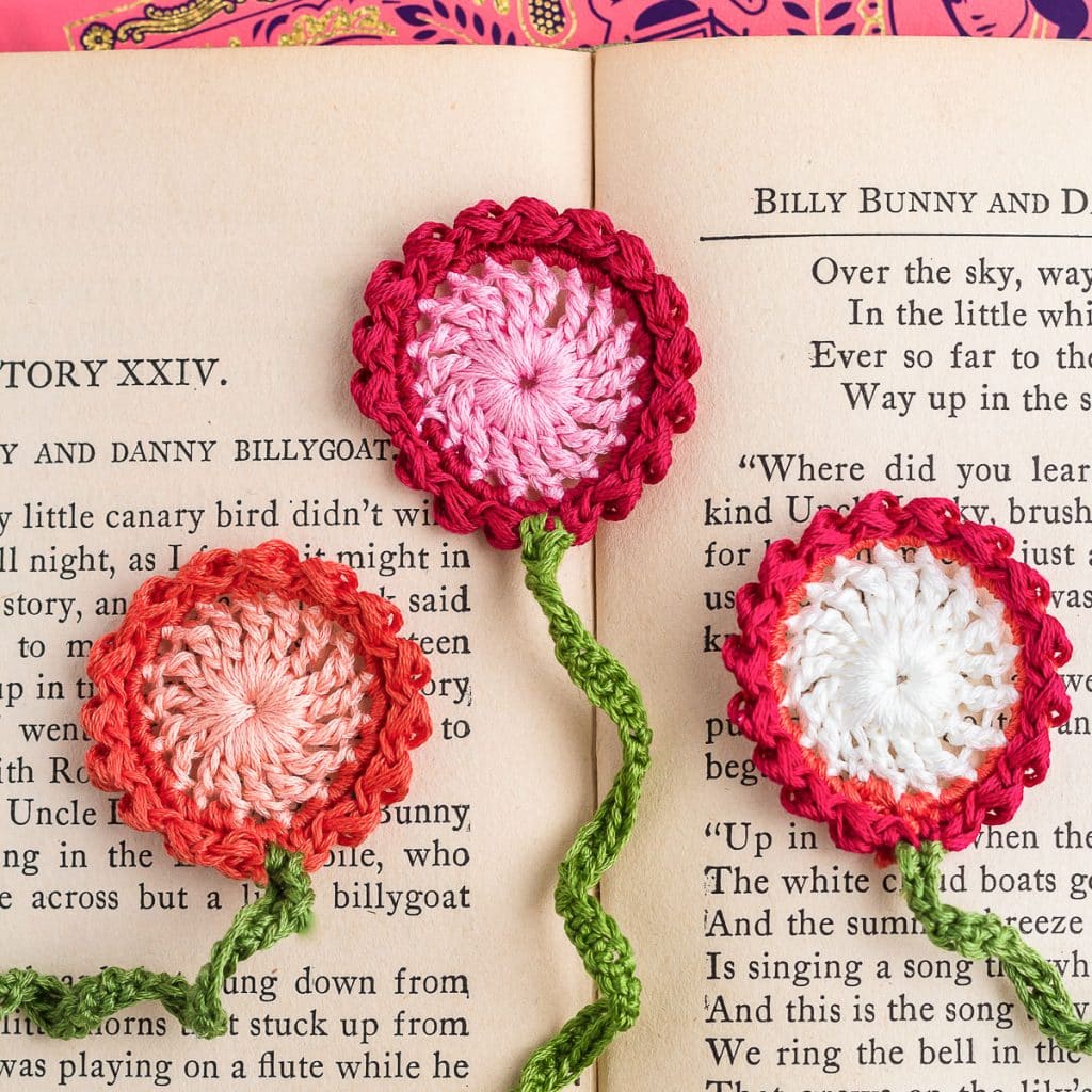 Crochet bookmarks on a book.