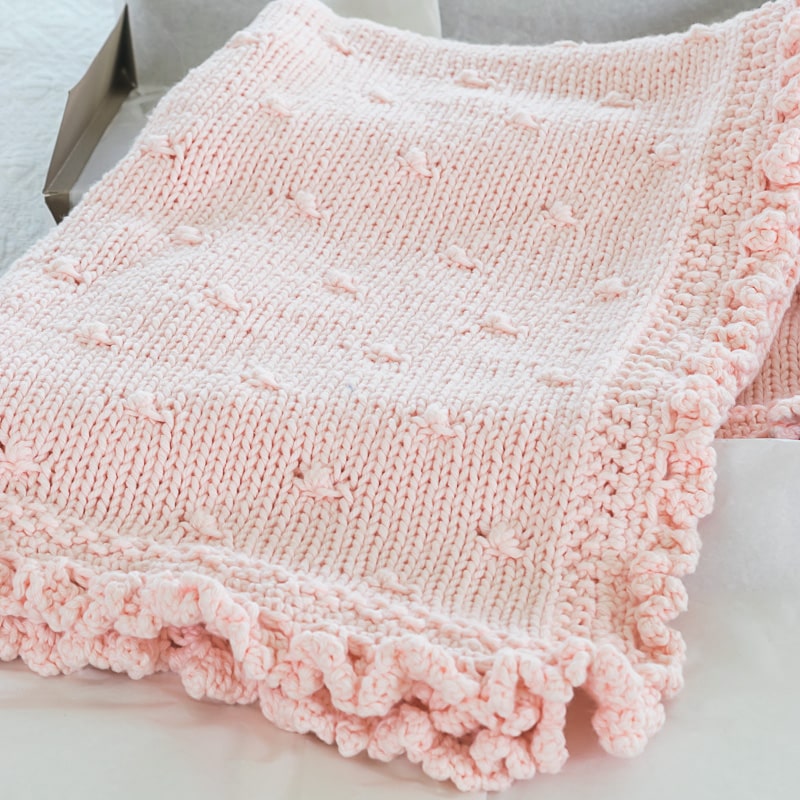 Pink Baby Blanket with ruffles.