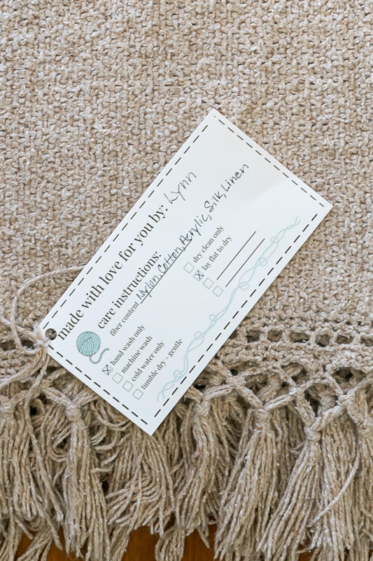Knit Care Tag on blanket.