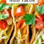 Air fried mini tacos stacked next to each other.