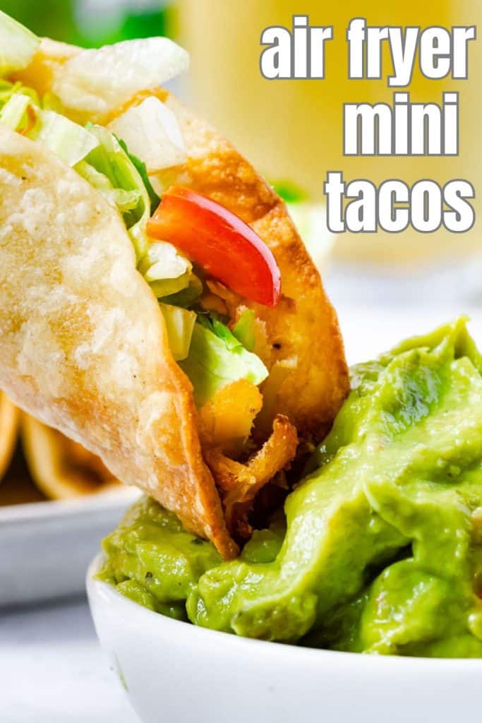 Mini Tacos dipped in guacamole.