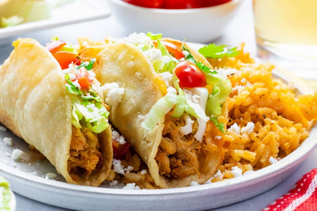 Air Fryer Mini Tacos on a plate with rice.