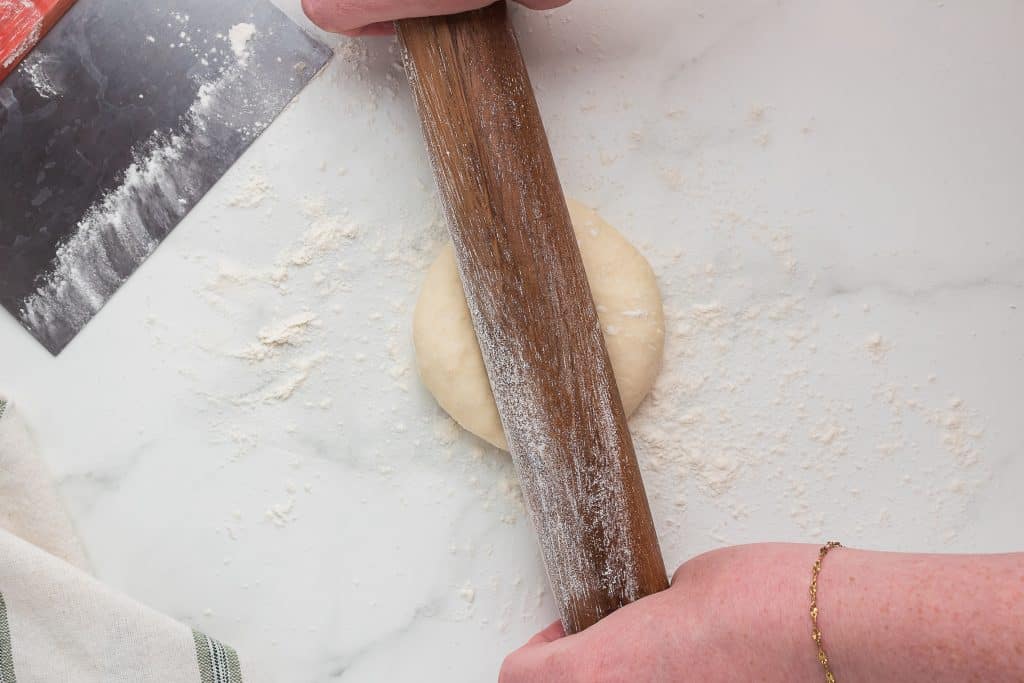 Roll tortilla dough.