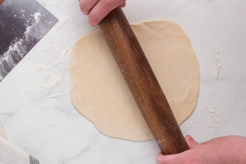Roll tortilla dough until 1/8" thick.