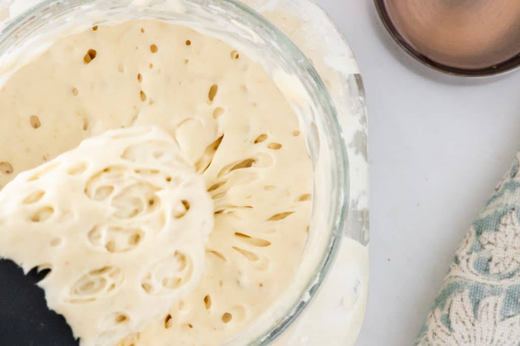 Stirring the starter helps to aerate and improve fermentation.