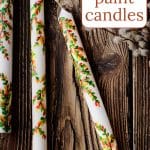 Painted candles on wood surface.